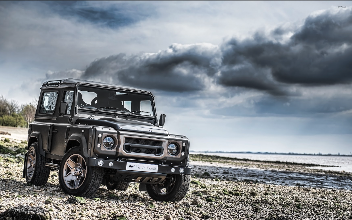 Custom Defender on rocky shore